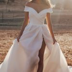 R3602 Allure Romance Crisp, architectural organza softly pleats and tucks along the waist and bodice of this romantic off shoulder gown